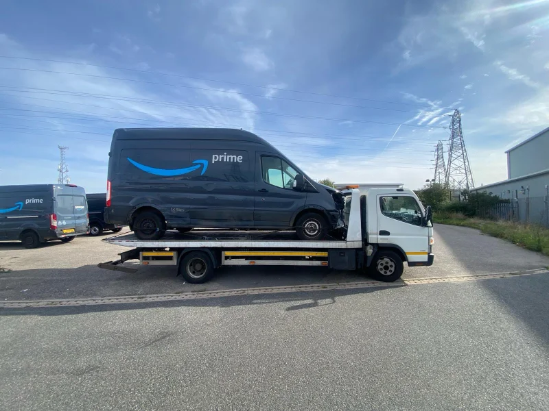 amazon vehicle being towed in east london